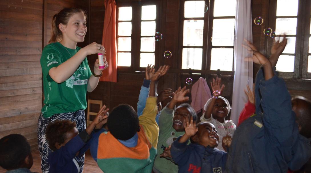 Fundraising is one way of financing your trip to Madagascar. A volunteer is having fun with children in Madagascar after she fundraised her trip to this African country.